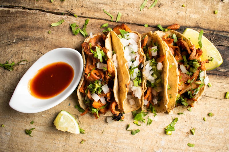 Three street-style pork tacos
